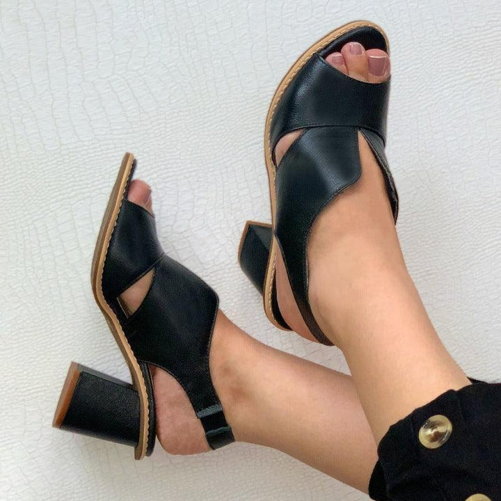 Chic women's heeled party sandals offering a comfortable footbed & secure buckle closure for evenings.