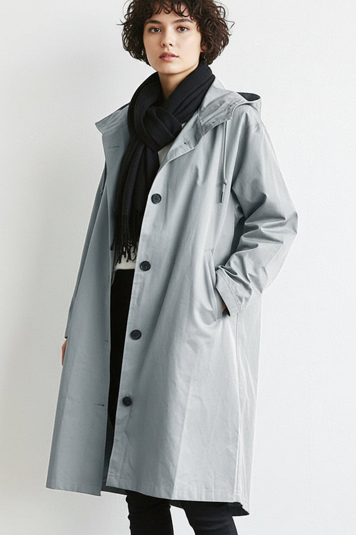 Women's stylish hooded waterproof rain trench coat. Lightweight long outerwear for wet weather.