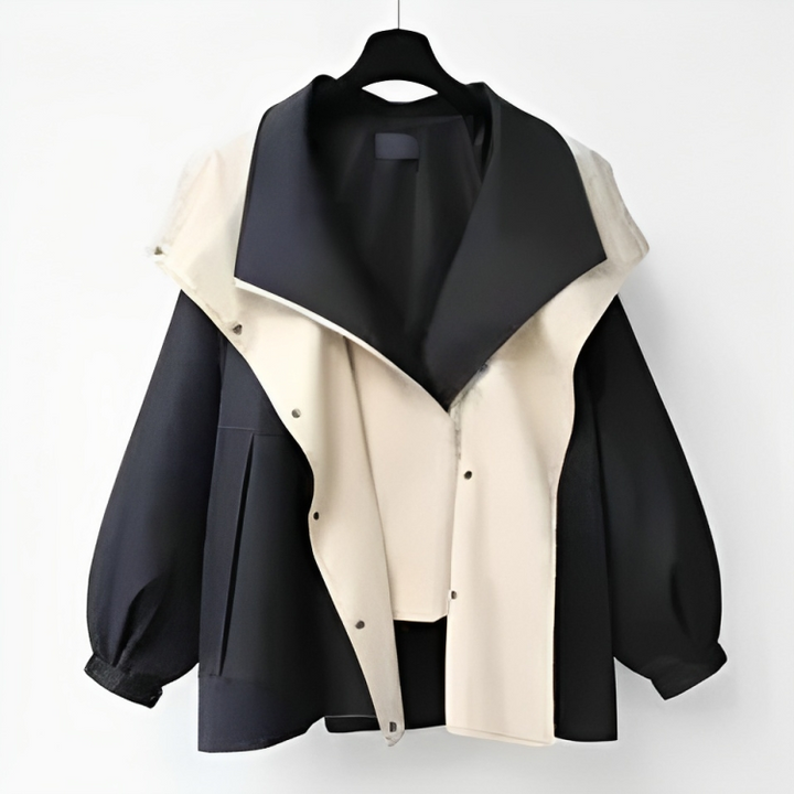 Fashionable women's waterproof rain jacket, a sleek hooded lightweight outerwear piece for all weather.
