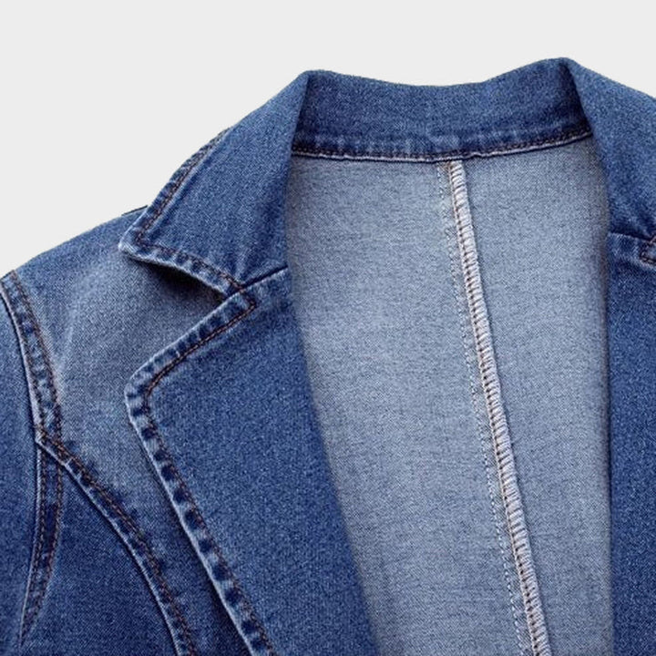 Elegant women's blue tailored blazer. This versatile, structured jacket offers a sophisticated look for any occasion.