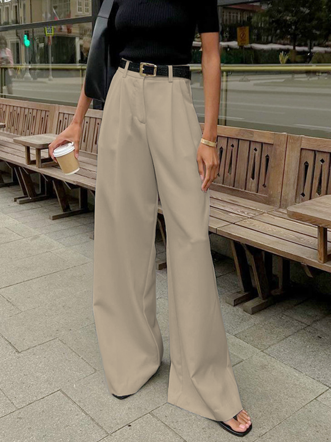 Women's tailored wide-leg trousers, high-waist and pleated, designed for versatile smart casual elegance.