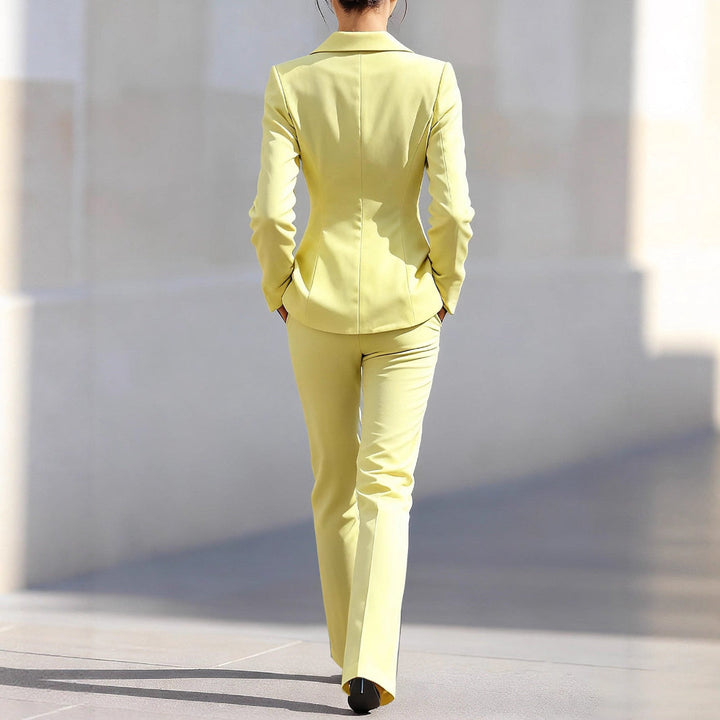 Chic women's yellow co-ord blazer and tailored trousers. Versatile & elegant professional business wear.