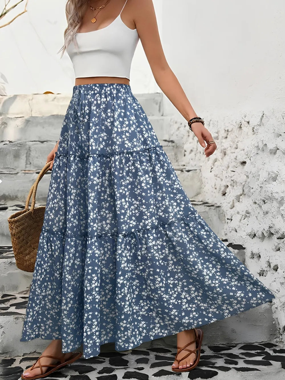 Women's tiered floral maxi skirt, perfect for summer. Flowy bohemian style, elegant and comfortable.