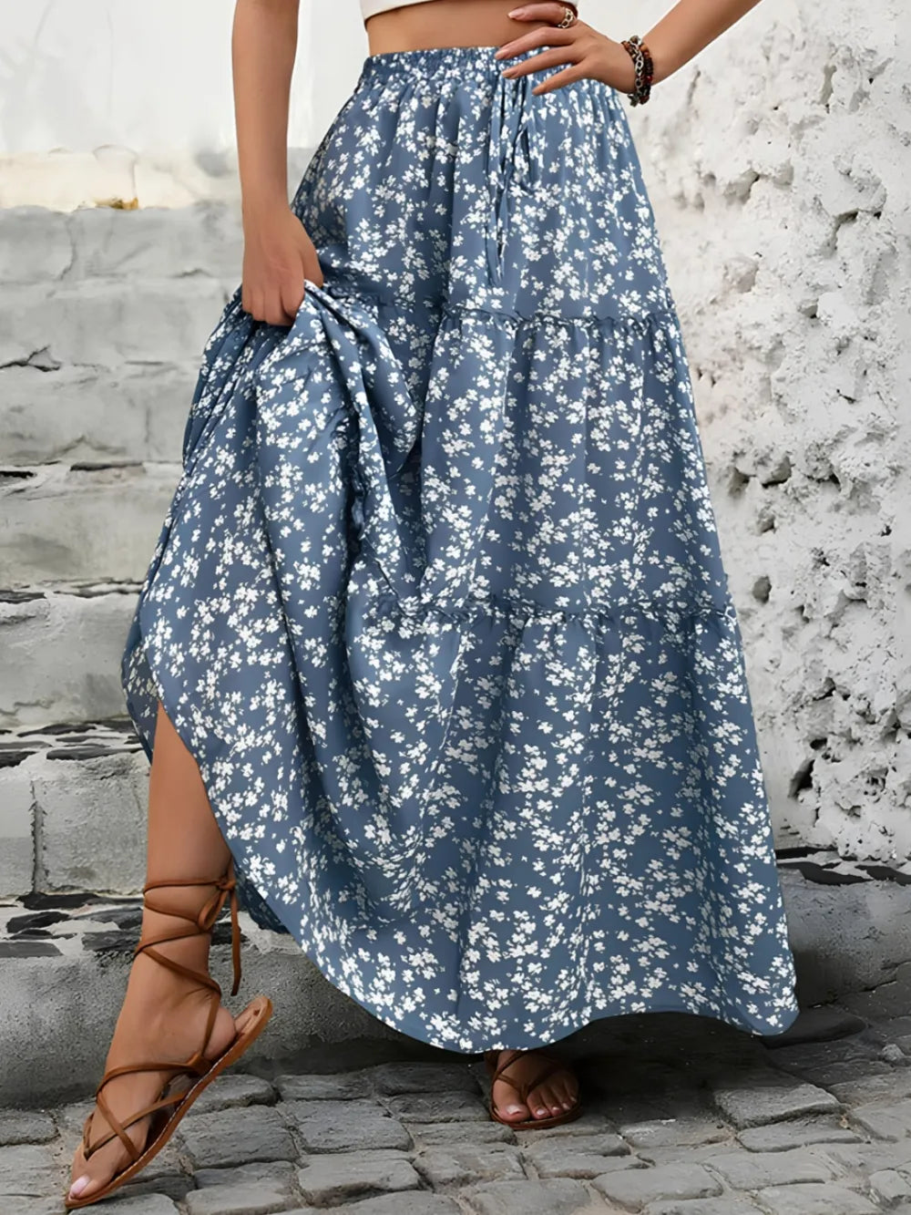 Long floral maxi skirt for women, ideal for summer vacations. Tiered, flowy bohemian casual style.