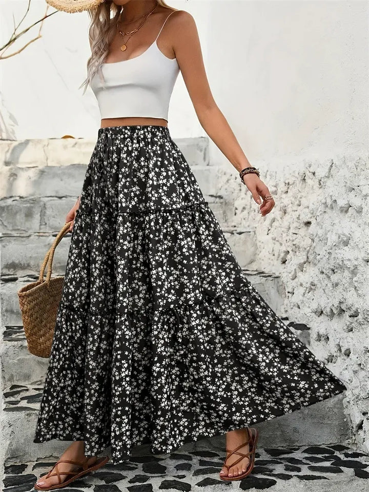 Bohemian floral maxi skirt for women, tiered and flowy. Perfect long summer skirt for casual wear or vacation.
