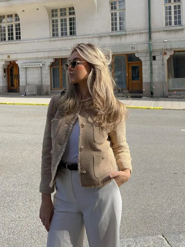 Anna's women's timeless tweed jacket, a chic blazer with eye-catching gold buttons, enhancing any elegant style.