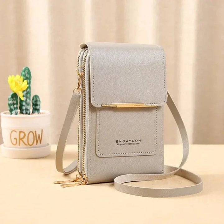 Elegant women's crossbody bag with touch screen phone pocket, ideal for shopping, travel, & errands.