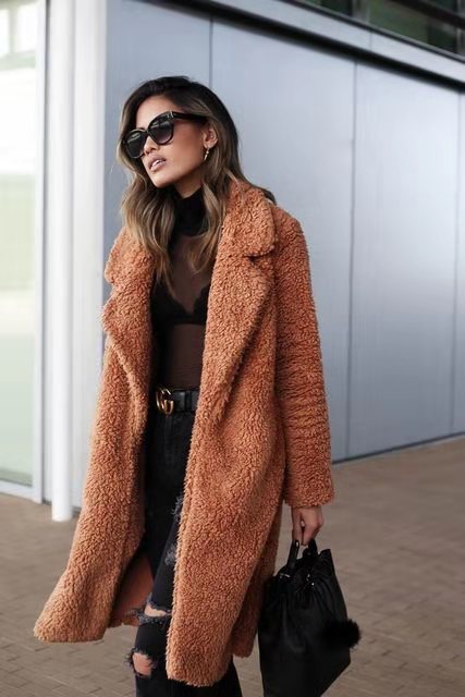 Plush long teddy coat for women, a cozy and fashionable winter outerwear for cold weather.