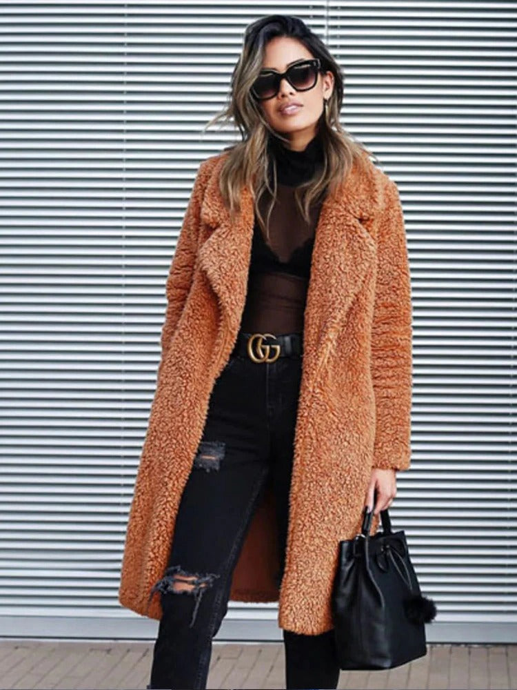 Elegant long teddy coat for women, offering warmth, style & comfort for winter fashion.