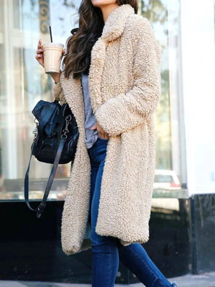 Soft teddy fleece long coat for women, offering warmth & comfort in stylish winter fashion.