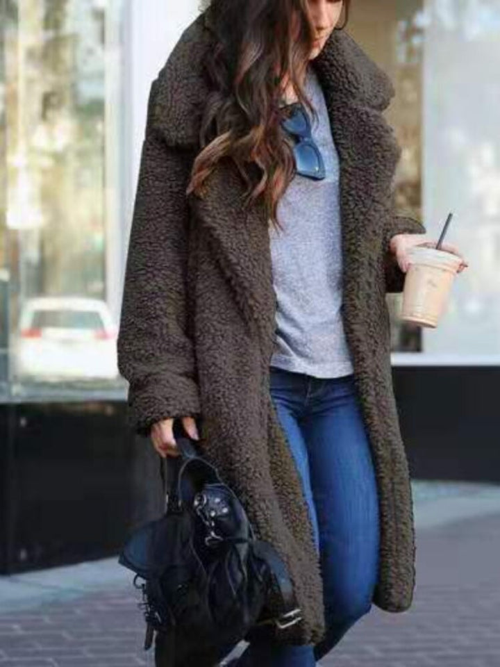 Cozy women's long teddy coat, a warm & trendy winter jacket for stylish outerwear.
