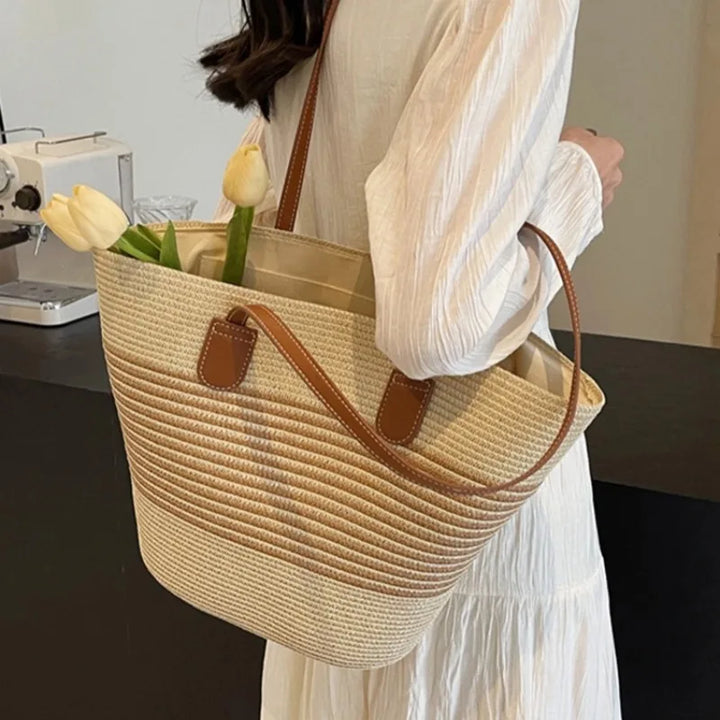 Elegant women's two-tone shoulder tote bag for beach and summer fashion. Versatile and casual accessory.
