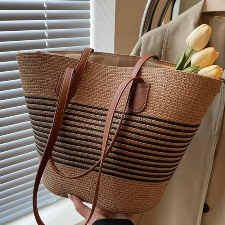 Modern two-tone beach tote for women. Large capacity, versatile shoulder bag in neutral colors for summer.