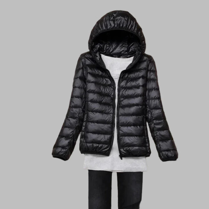 Women's ultra-light packable hooded winter coat, ideal for travel. Lightweight outdoor jacket offering warmth & versatility.