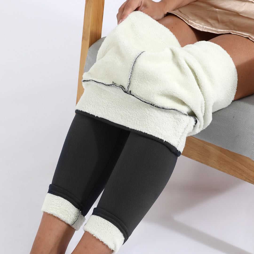 Model wearing comfy, stretchy women's winter leggings; designed for warmth & freedom of movement.