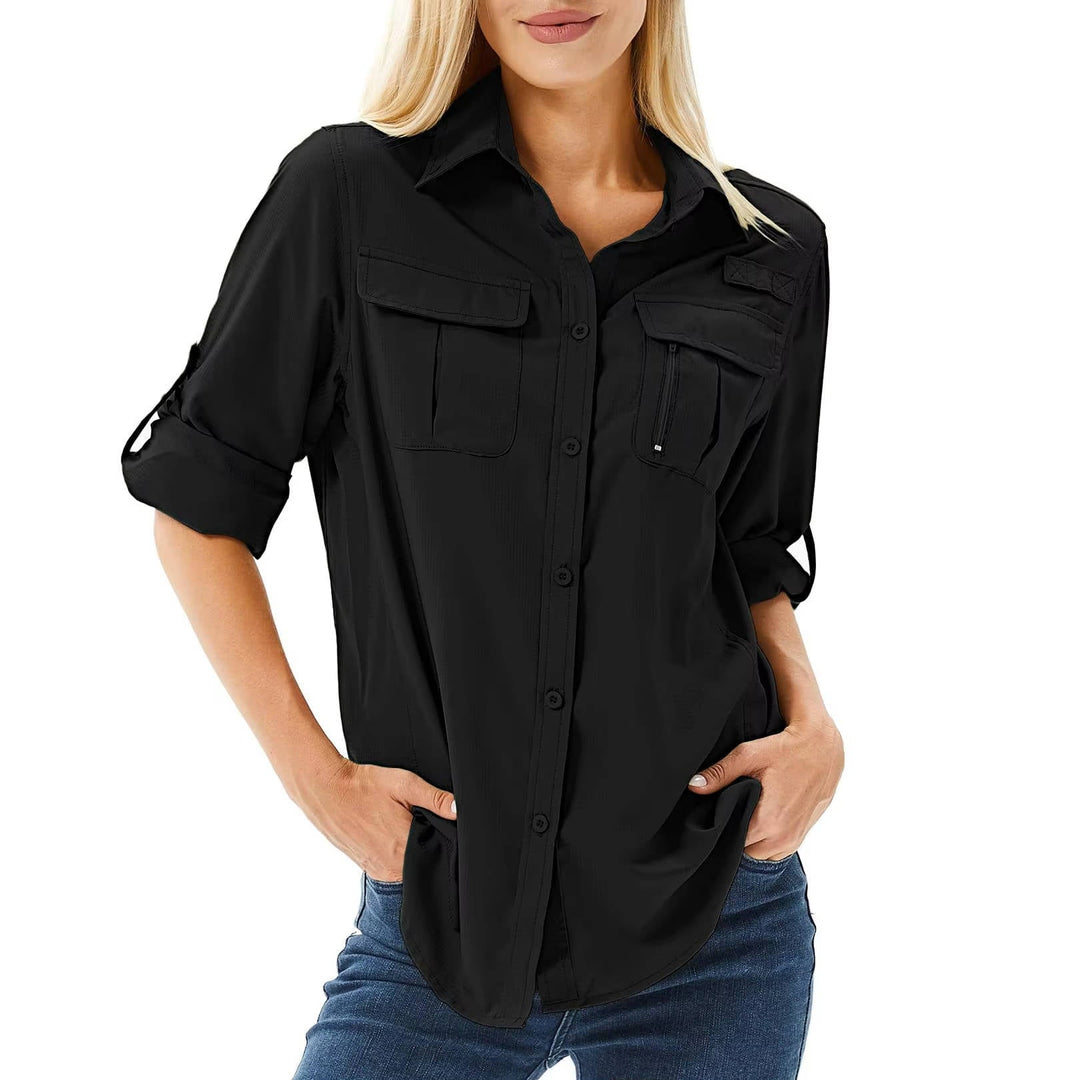 Woman in UPF 50 long sleeve hiking shirt, enjoying sun-safe outdoor adventure & activewear comfort.