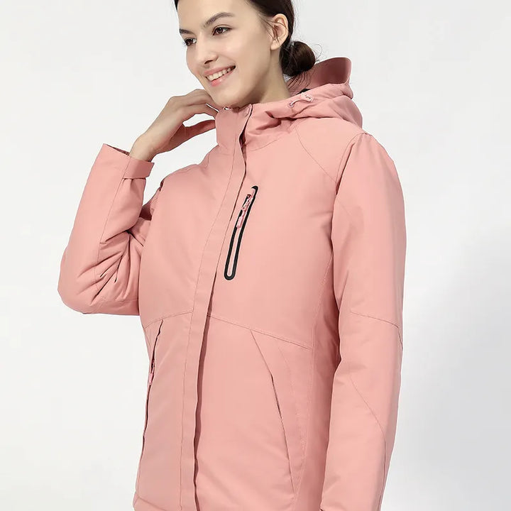 Stylish women's heated winter coat with hood & multiple pockets. Perfect thermal outdoor wear.