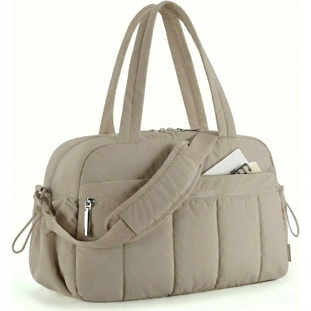 Black women's duffle bag, ideal for gym, travel, and work. Features a practical pocket, functions as a shoulder or carryall bag.