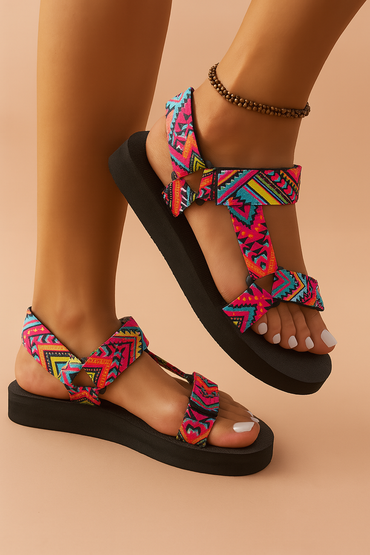 Colorful women's ethnic strap sandals, vibrant summer footwear perfect for casual outfits or beach days.