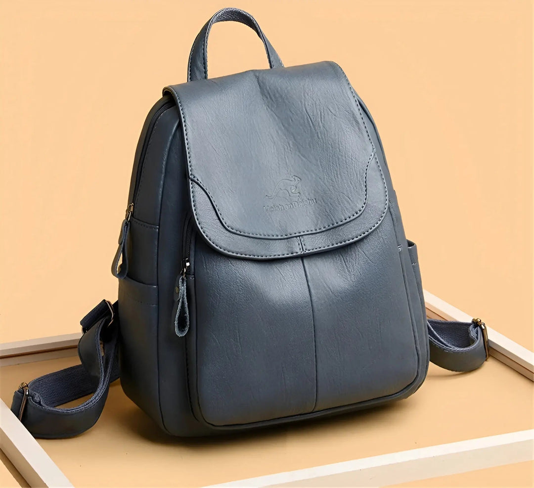 Adventurous woman with a waterproof vintage leather everyday backpack, explore in anti-theft style.