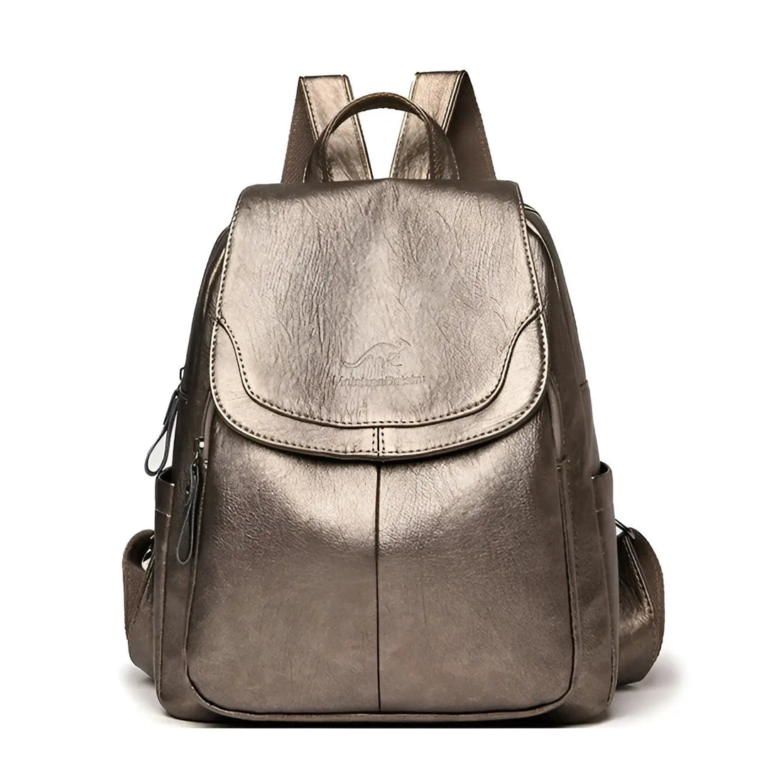 Rich vintage brown leather texture on a women's anti-theft travel backpack, waterproof & durable.