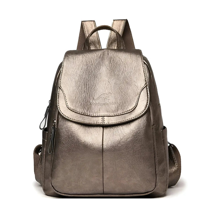 Rich vintage brown leather texture on a women's anti-theft travel backpack, waterproof & durable.