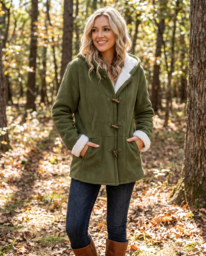 Stylish women's hooded winter coat with toggle closures. Cozy and warm outerwear for cold weather fashion.
