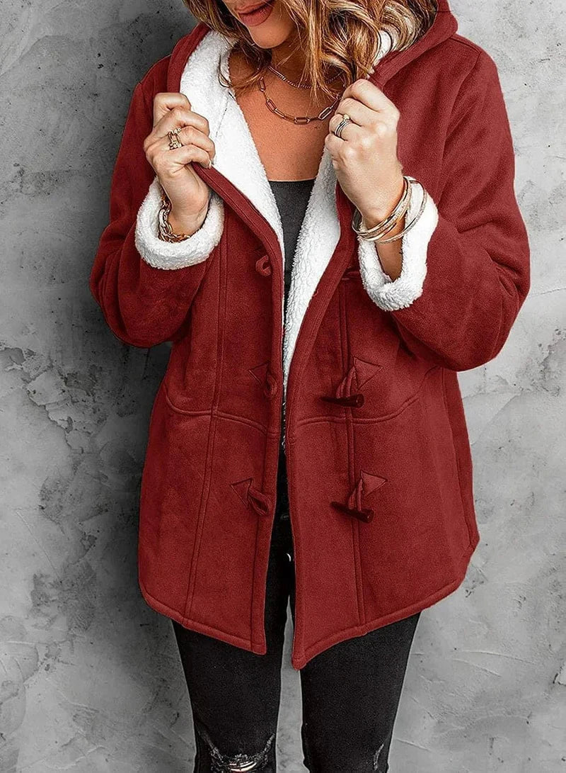Cozy women's hooded winter coat, ideal for staying warm in cold weather. Durable and fashionable outerwear.