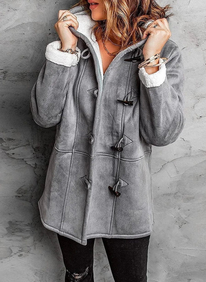 Women's hooded outdoor winter coat for extreme cold. Durable, warm, and stylish protection against elements.
