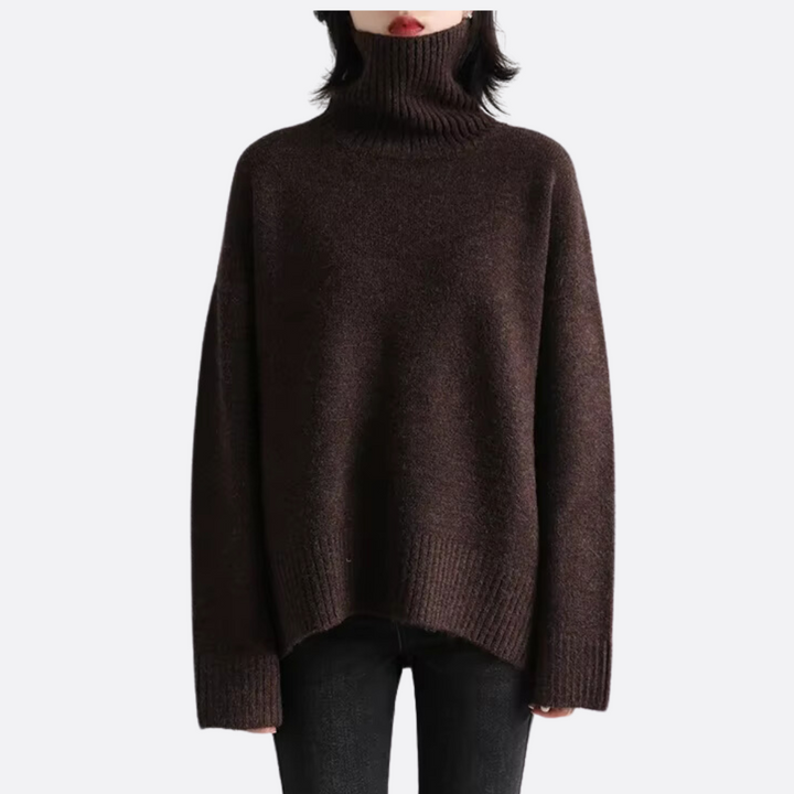 Women's warm oversized turtleneck sweater in a cozy knit, perfect for winter fashion and relaxed comfort.