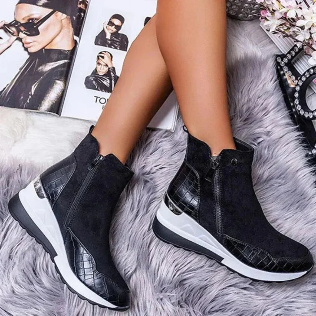 Close-up of women's waterproof zipper ankle boots, showcasing the weather-resistant material and robust traction sole.
