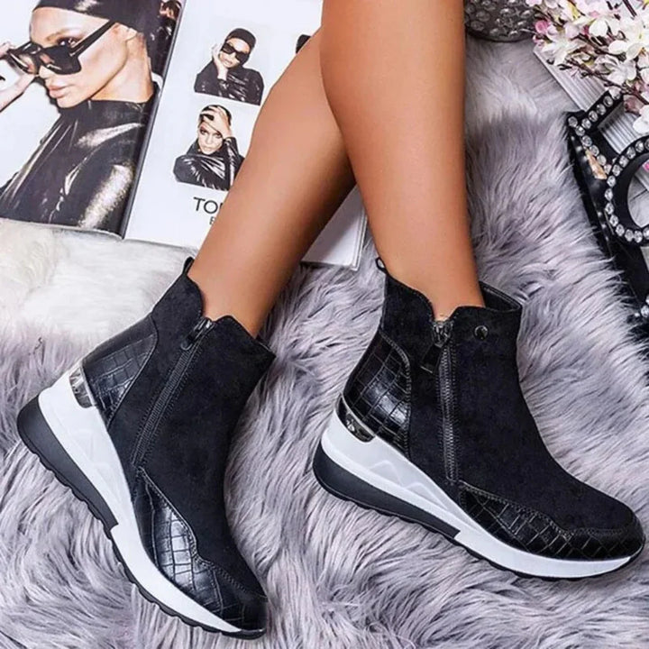 Close-up of women's waterproof zipper ankle boots, showcasing the weather-resistant material and robust traction sole.