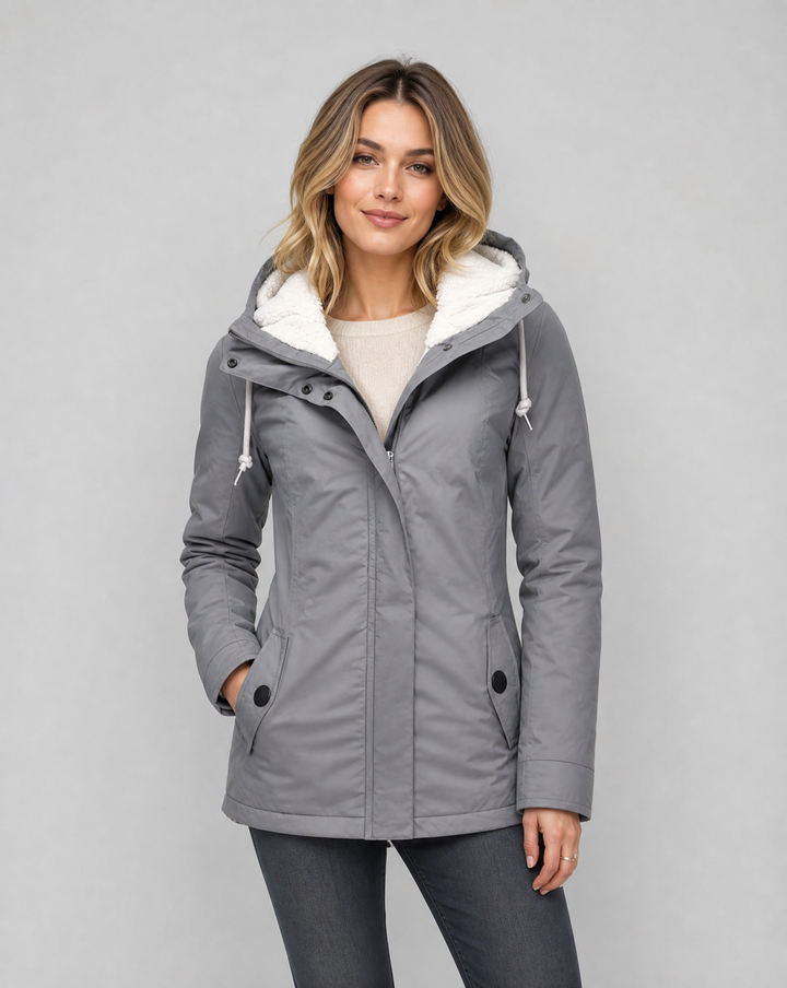 Women's waterproof rain jacket with hood, ideal for all-weather comfort & protection.