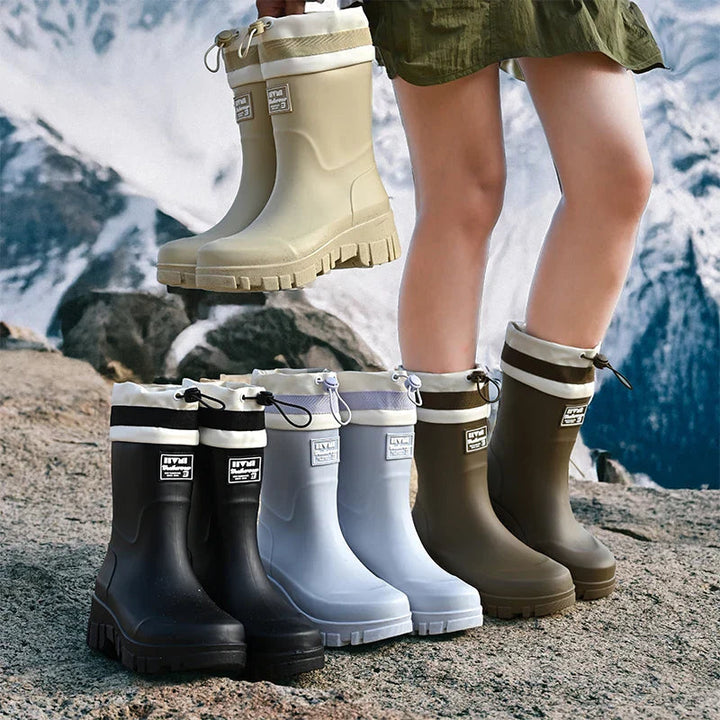 Black women's waterproof outdoor boots, durable slip-on for all seasons.