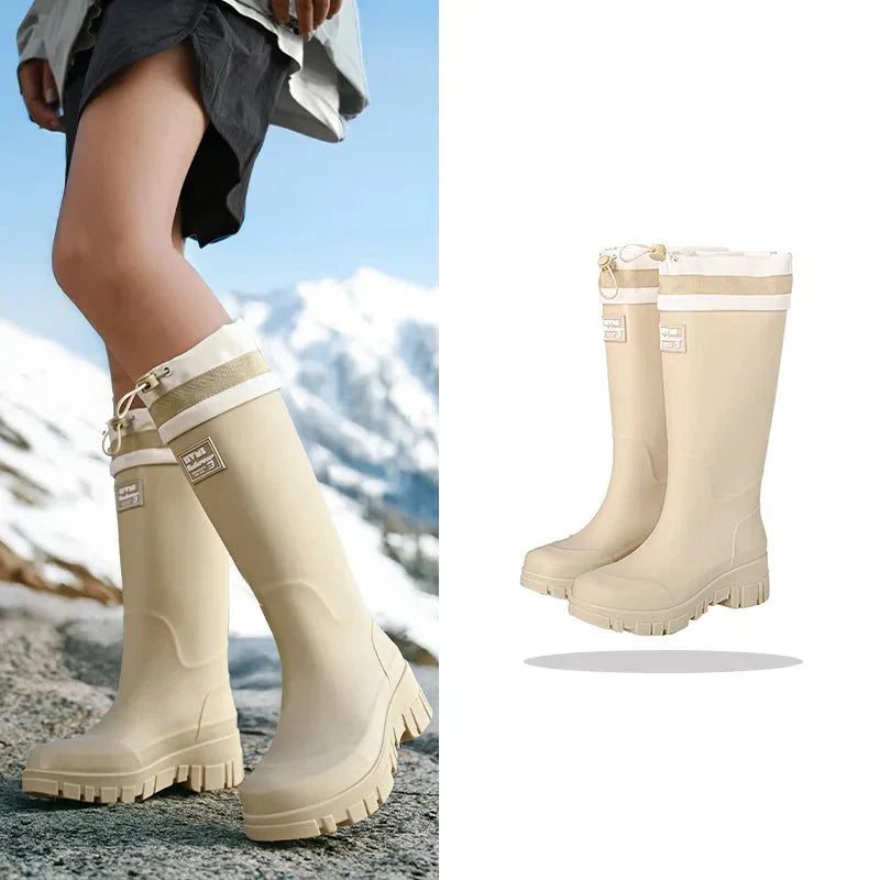 Women's fashion rain boots, sleek and waterproof for a rainy day outfit.