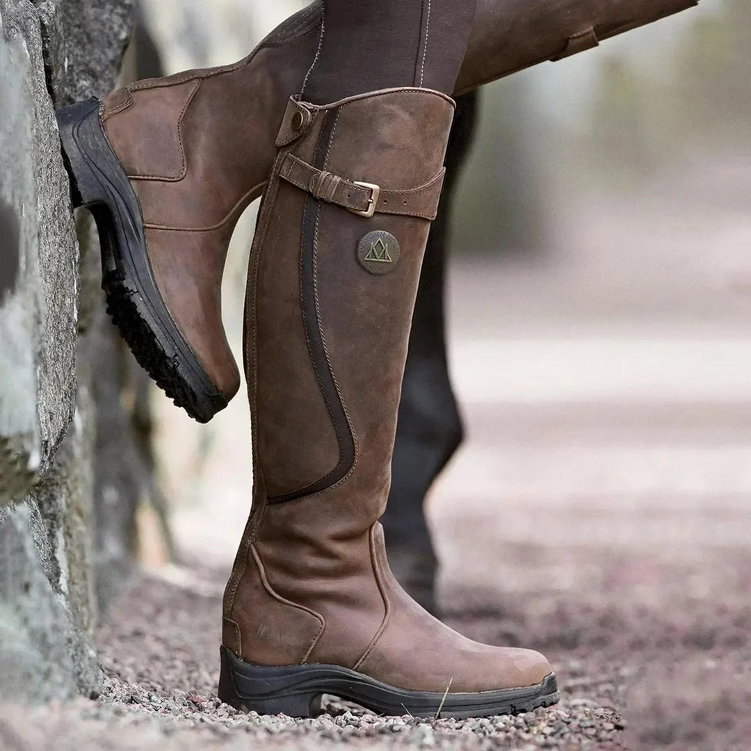 Women's waterproof winter riding boots. Tall, durable equestrian footwear for all-weather outdoor style & comfort.