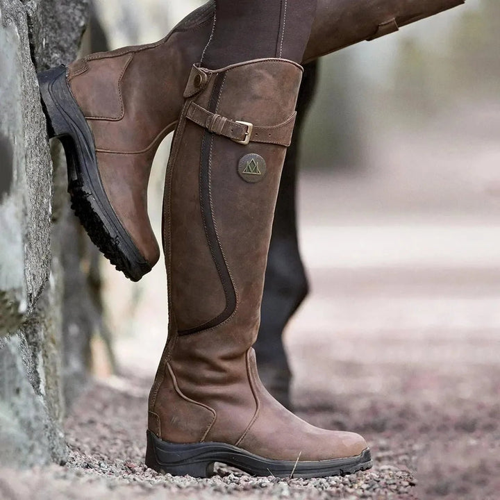 Women's waterproof winter riding boots. Tall, durable equestrian footwear for all-weather outdoor style & comfort.
