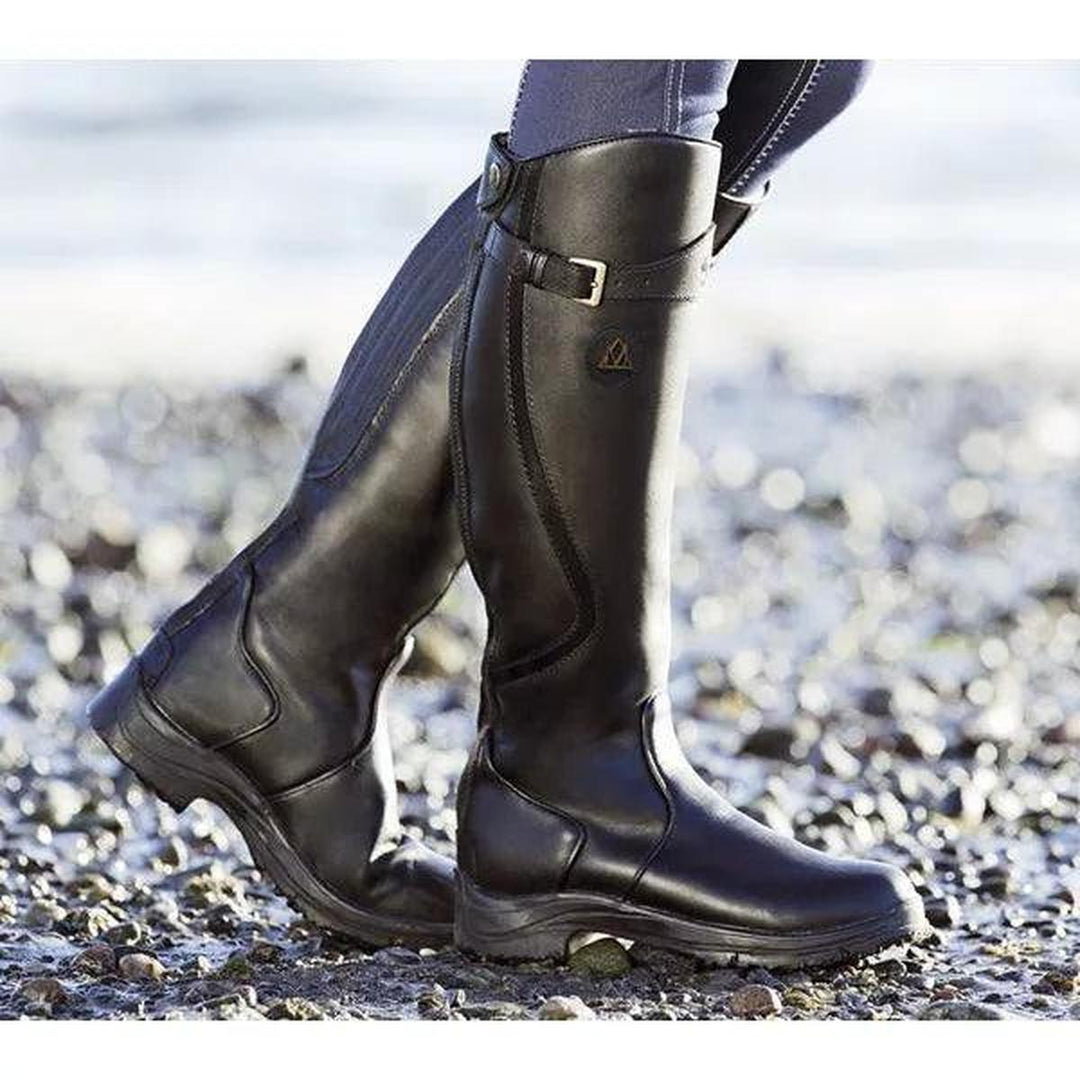 Durable women's waterproof tall boots. Versatile winter riding footwear for outdoor adventures & fashion.