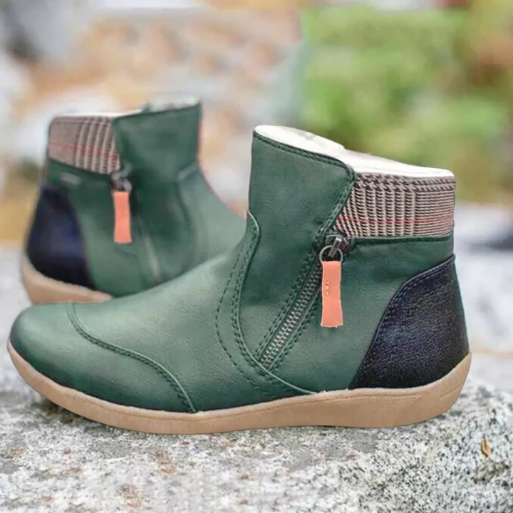 Women's weather-resistant winter ankle boots, perfect for cold, snowy days. Durable lace-up design.