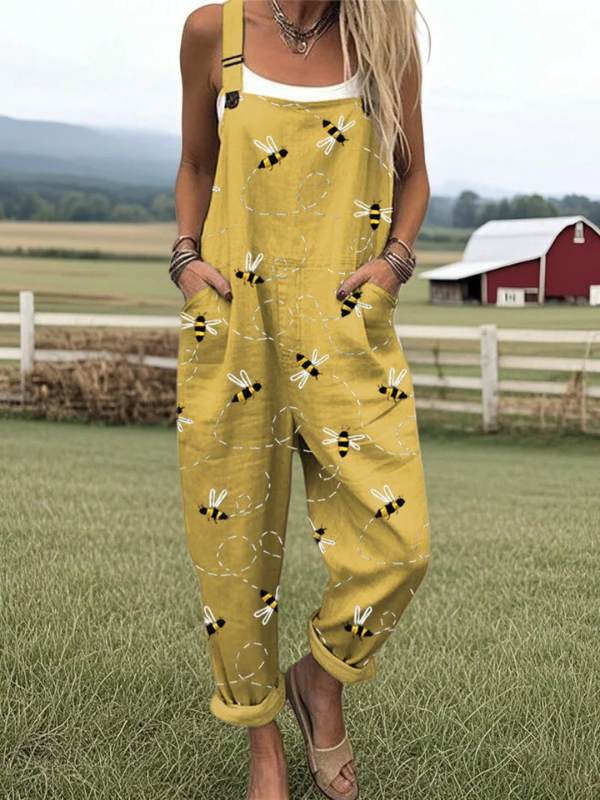 Women's whimsical yellow honeybee print jumpsuit; comfortable & stylish dungarees for summer casual wear.