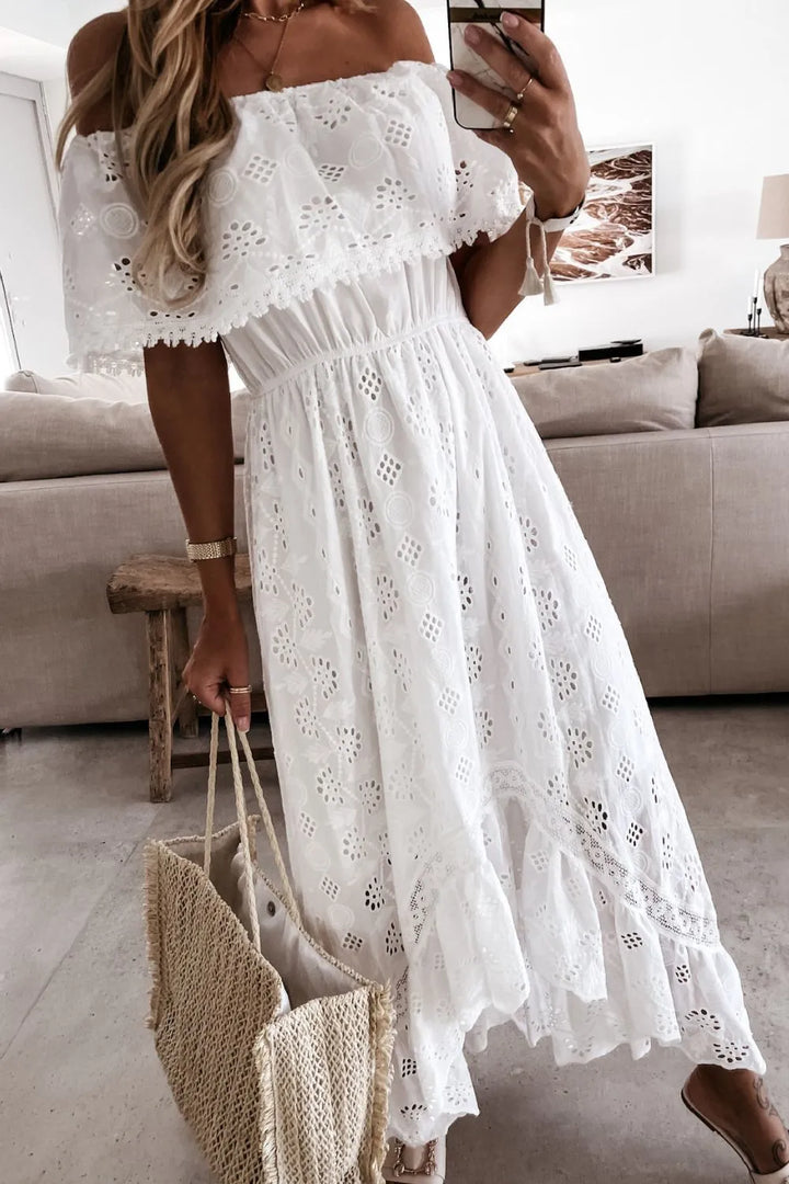 Detailed white lace off-shoulder dress with ruffled high-low hem, an elegant and flowy summer cocktail dress.
