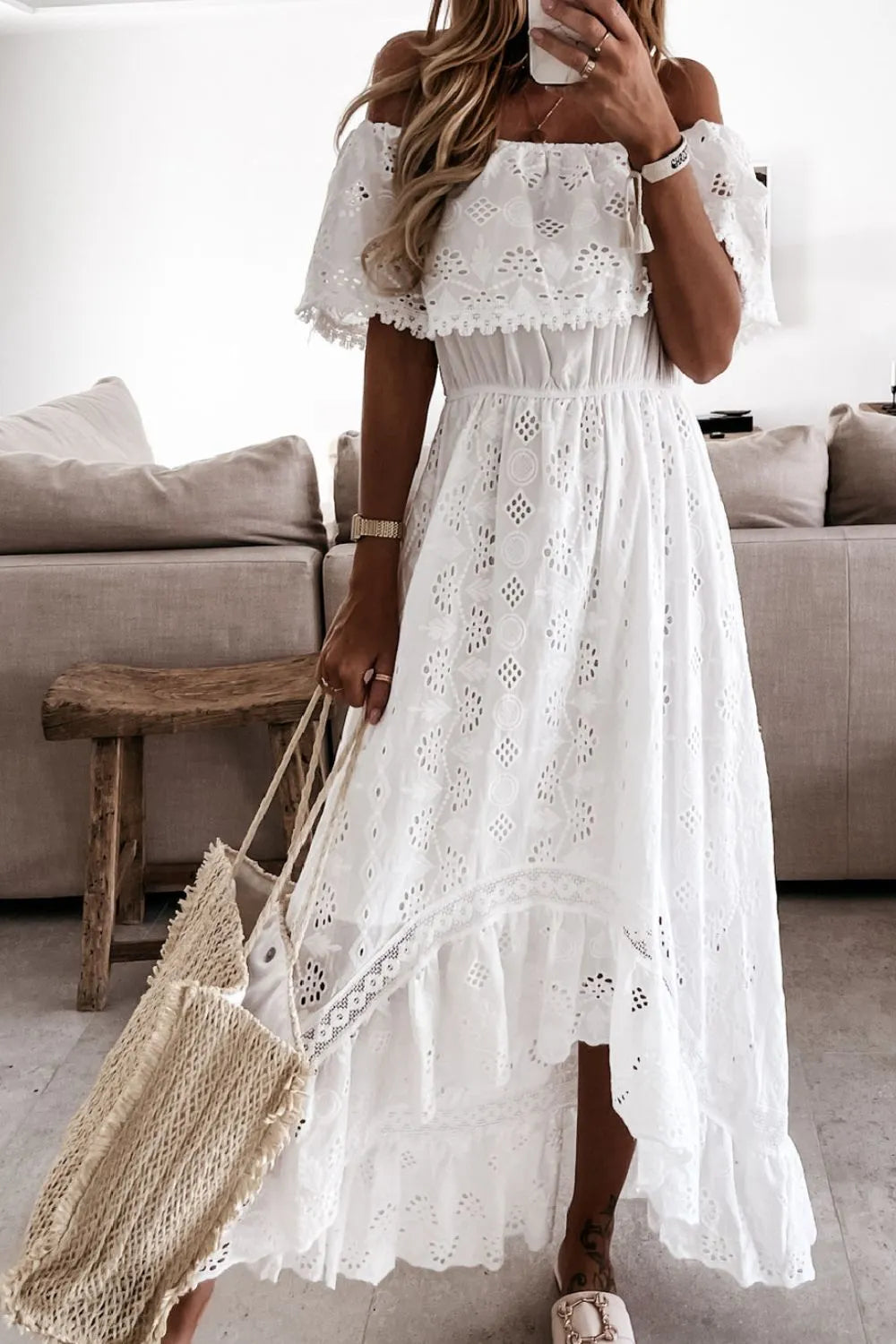 Elegant white lace off-shoulder high-low dress with ruffles, versatile for summer parties, boho events, or wedding guests.