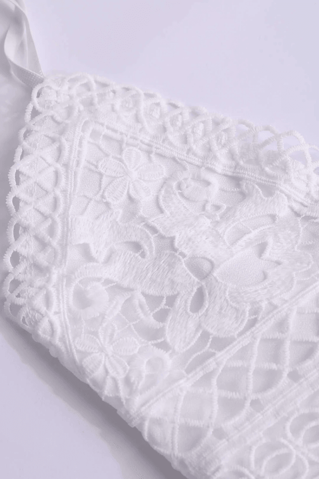 Sleeveless white mini ruffle V-neck dress, a versatile summer day dress or chic evening look for women.