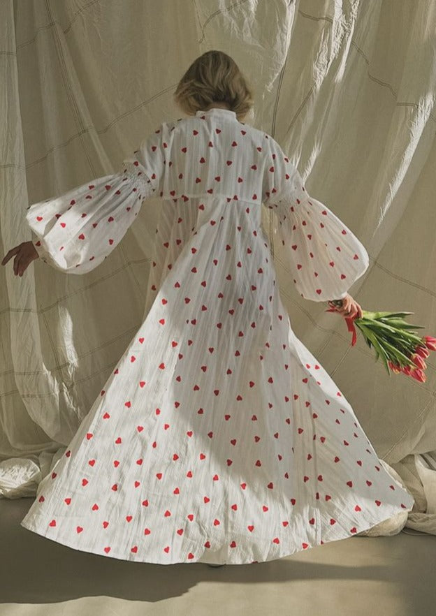 Romantic white maxi dress with oversized silhouette and all-over heart embroidery for women.