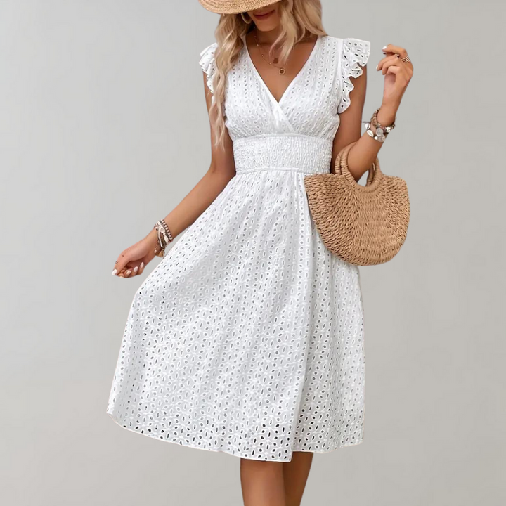 Stylish white midi dress for women, featuring delicate ruffled sleeves, ideal for warm weather comfort.