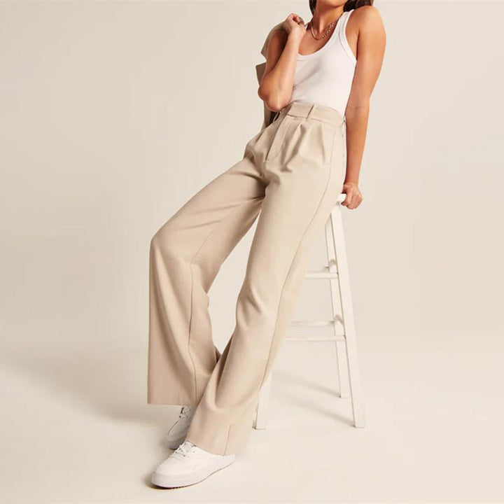 Elegant women's high-waisted wide-leg tailored pants with pleats, ideal for sophisticated workwear.