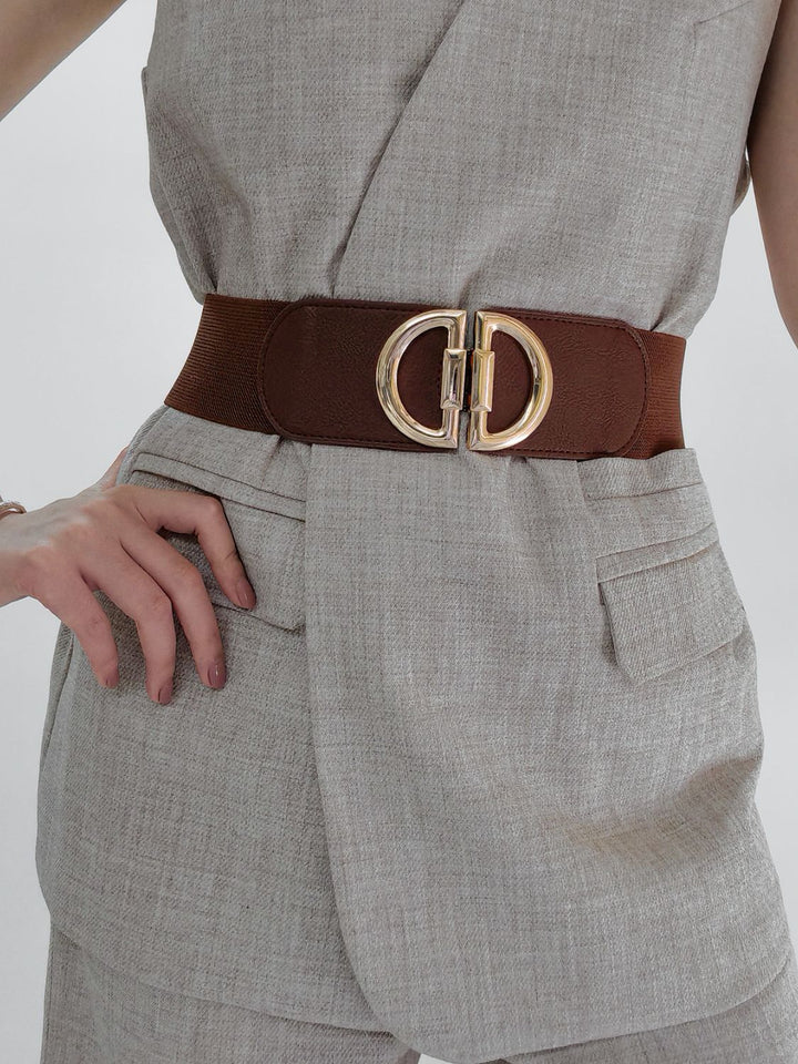 Stylish women's wide stretch waist belt featuring a chic buckle, ideal for a cinched look.