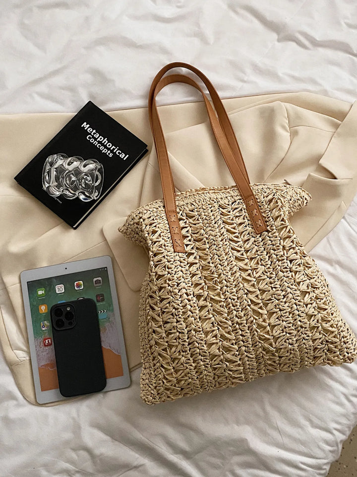 Women's woven straw shoulder bag, a perfect summer accessory for beach trips, vacation & casual style.