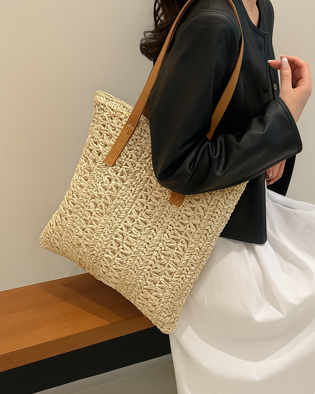 Chic women's straw tote bag with woven detail, ideal for summer, beach, and vacation outfits.