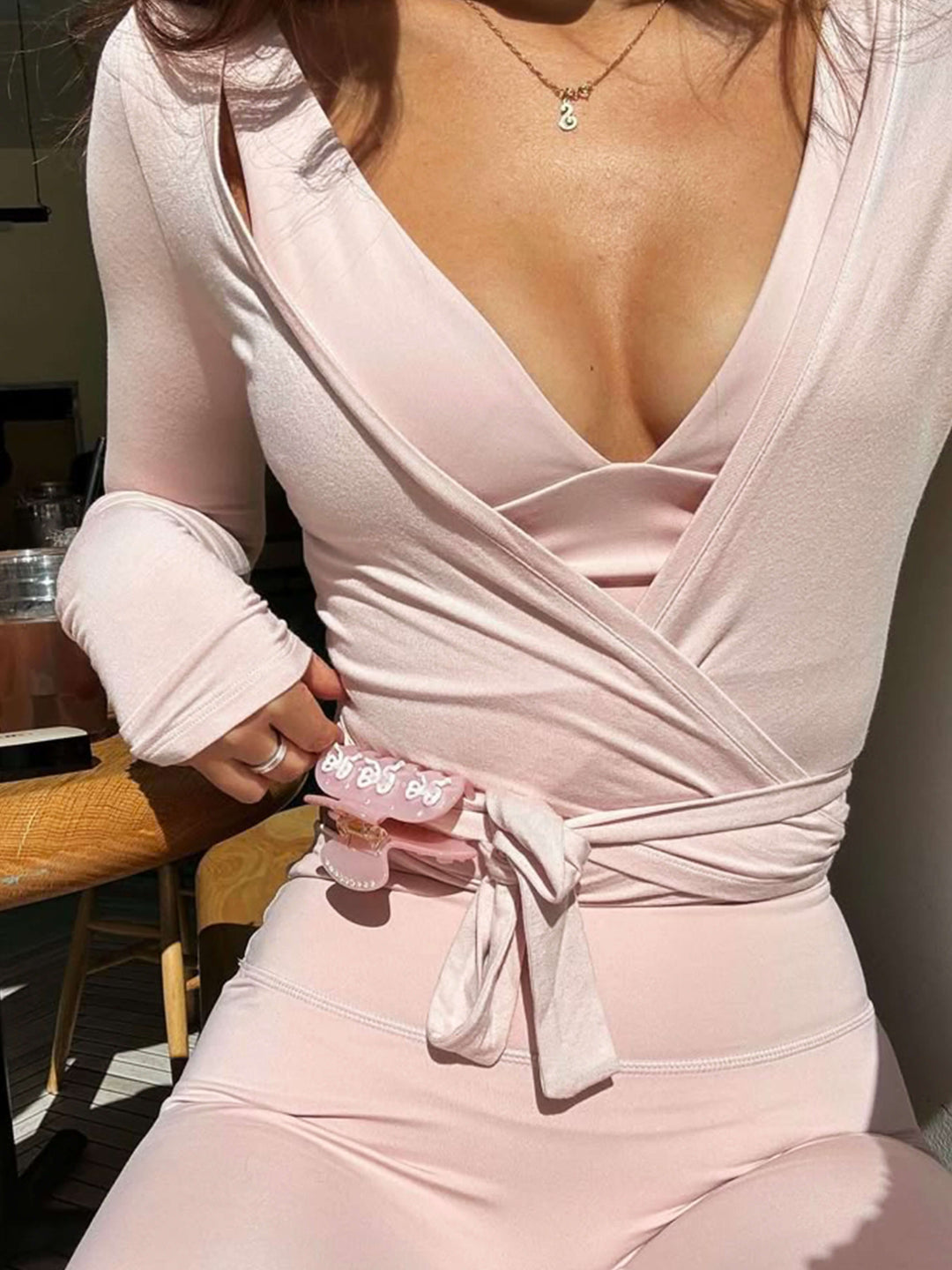 Versatile women's V-neck wrap front long sleeve activewear, perfect for loungewear.